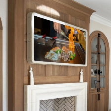 65" Framed TV - Leather Jerry Pair - Incredibull - Mist (L55) Framed TV with rounded corner white leather over mantel fireplace