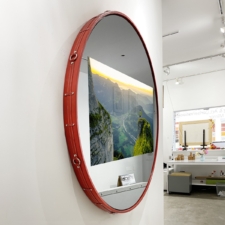55" Circle Contour - Red Leather with Chrome rings and studs on sides Red Circle Frame on White Wall