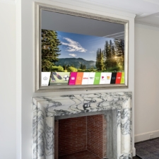 65" Landscape Plus - Gilded Carved Silver white gold carved framed TV in Mirror over a white marble fireplace