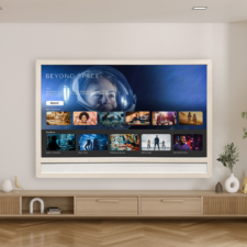 83" Framed TV w/ speaker bar - Vinyl from Holly Hunt Framed TV with soundbar turned on in modern living room.