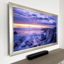 65" Landscape - Gilded Shaped 65 landscape edge to edge mirror television with white gold frame in bedroom