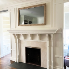 55" Landscape - Specialty Wood w/ scallop edges mirror tv in living room with light toned wood frame hand carved