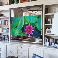 65" Square Plus - Modern Wood recessed square oriented mirror tv with a custom wood frame recessed into entertainment center