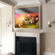 65" Landscape Plus - Gilded Carved GC1-A 65 inch taller mirror tv with a gilded gold frame over a mantel fireplace