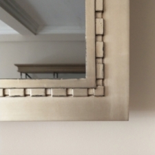 Gilded Carved - GC1-A corner close up of a custom tv mirror carved gilded frame