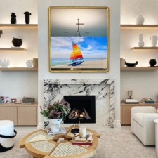 65" TV in Rounded Corner - Modern Yellow Gold Gilded Carved Frame Contemporary staged living room by an interior designer with a hidden gold-framed TV over a marble fireplace.