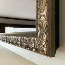 Signature Carved - SC25-S-O Silver prefinished frame on a TV Mirror over mantel