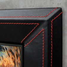 Black Leather with Ferrari-inspired red stitching Black leather TV Frame with red Ferrari-inspired stitching