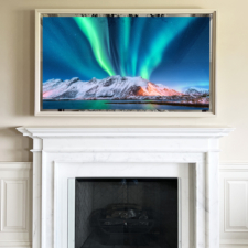 TV Mirror over mantel fireplace with a thin white wood frame