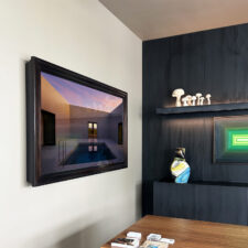 65" Landscape - Mahogany - Assure Interiors - Holiday House Wellington mahogany wood mirror television installed in office room for Holiday House Wellington